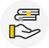 A hand holding a book with a yellow ribbon